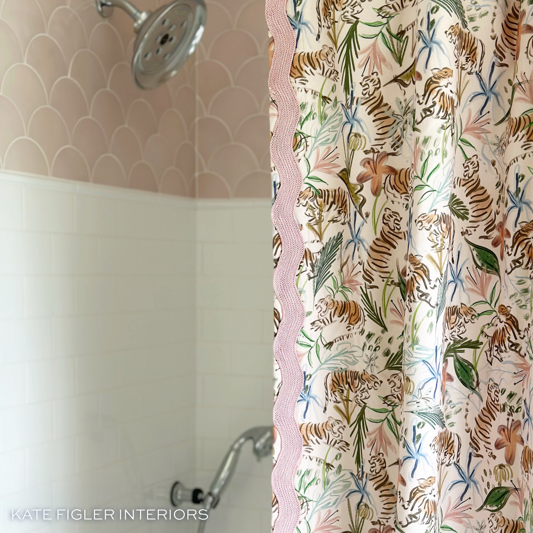 pink floral shower curtain with tigers on it and pink zig zag trim in front of a shower with pink and white tiles