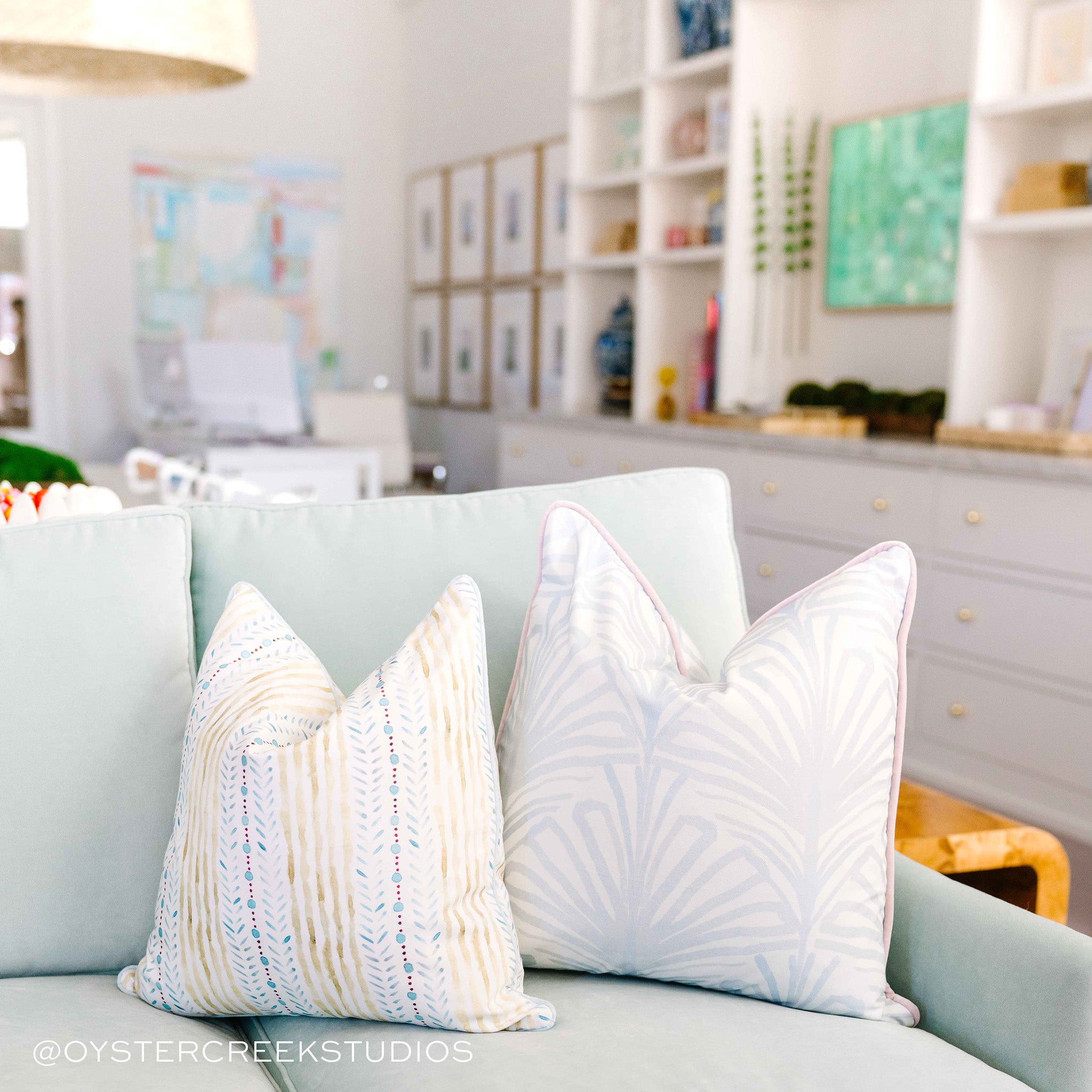 Couch Close-up with Blue & Green Striped Printed Pillow and Sky Blue Palm Printed Pillow. Photo taken by Oyster Creek Studios