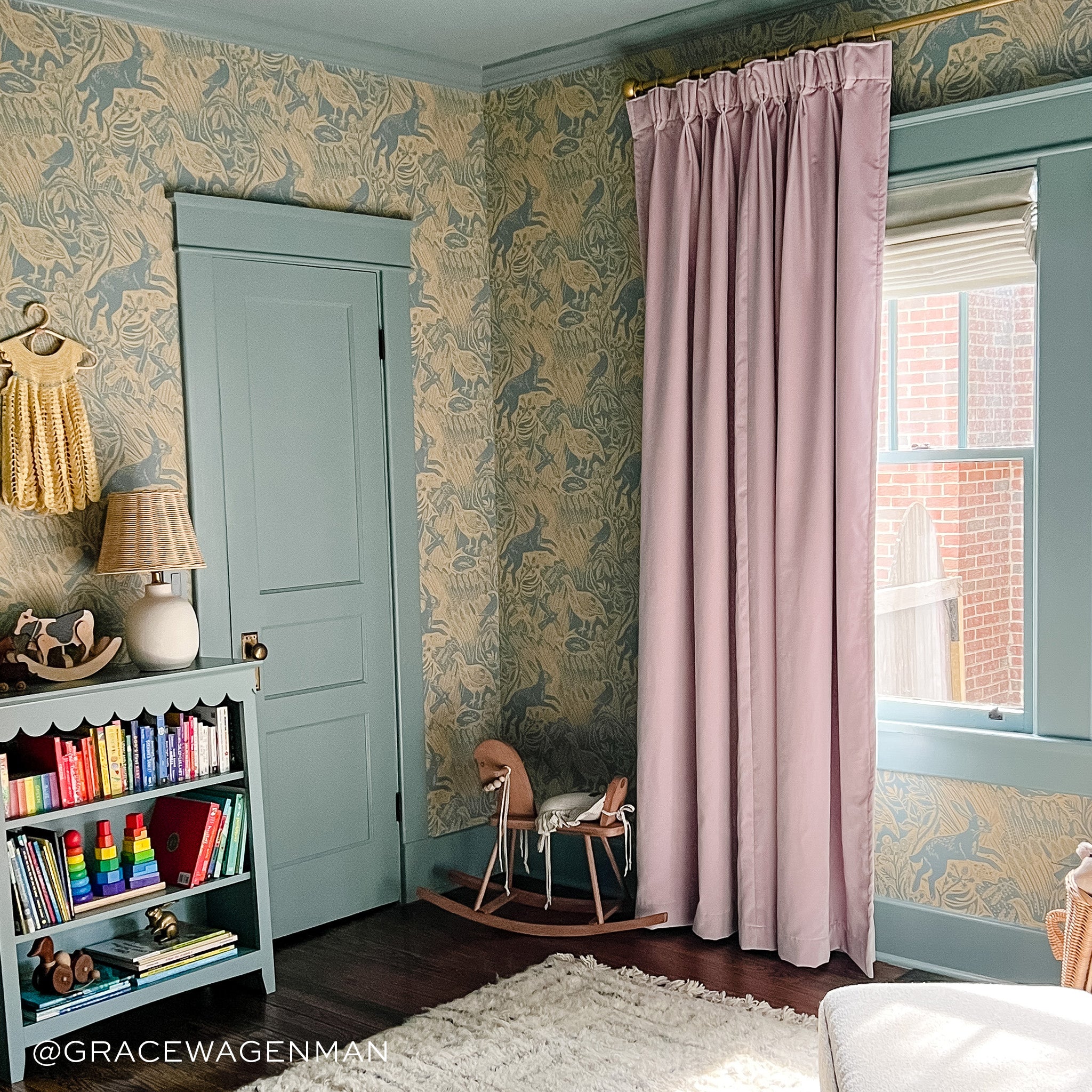 Bedroom corner styled with Lilac Velvet Curtains next to illuminated window with Animal printed wallpaper. Photo taken by Grace Wagenman