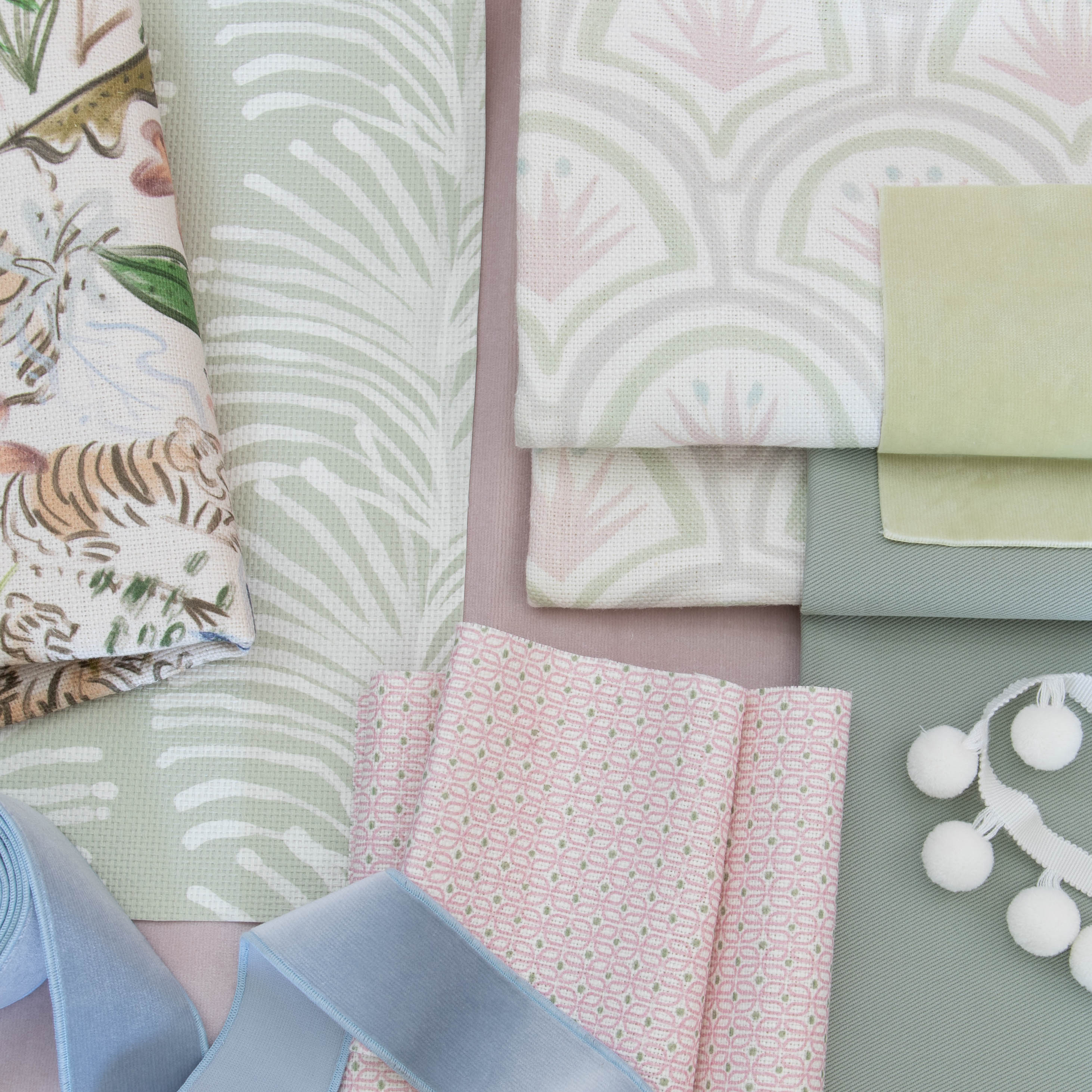 Interior design moodboard and fabric inspirations close-up with Pink Chinoiserie Tiger Printed Linen Swatch, Sage Green Printed Linen Swatch, Green Linen Swatch, and Pink Geometric Printed Linen Swatch