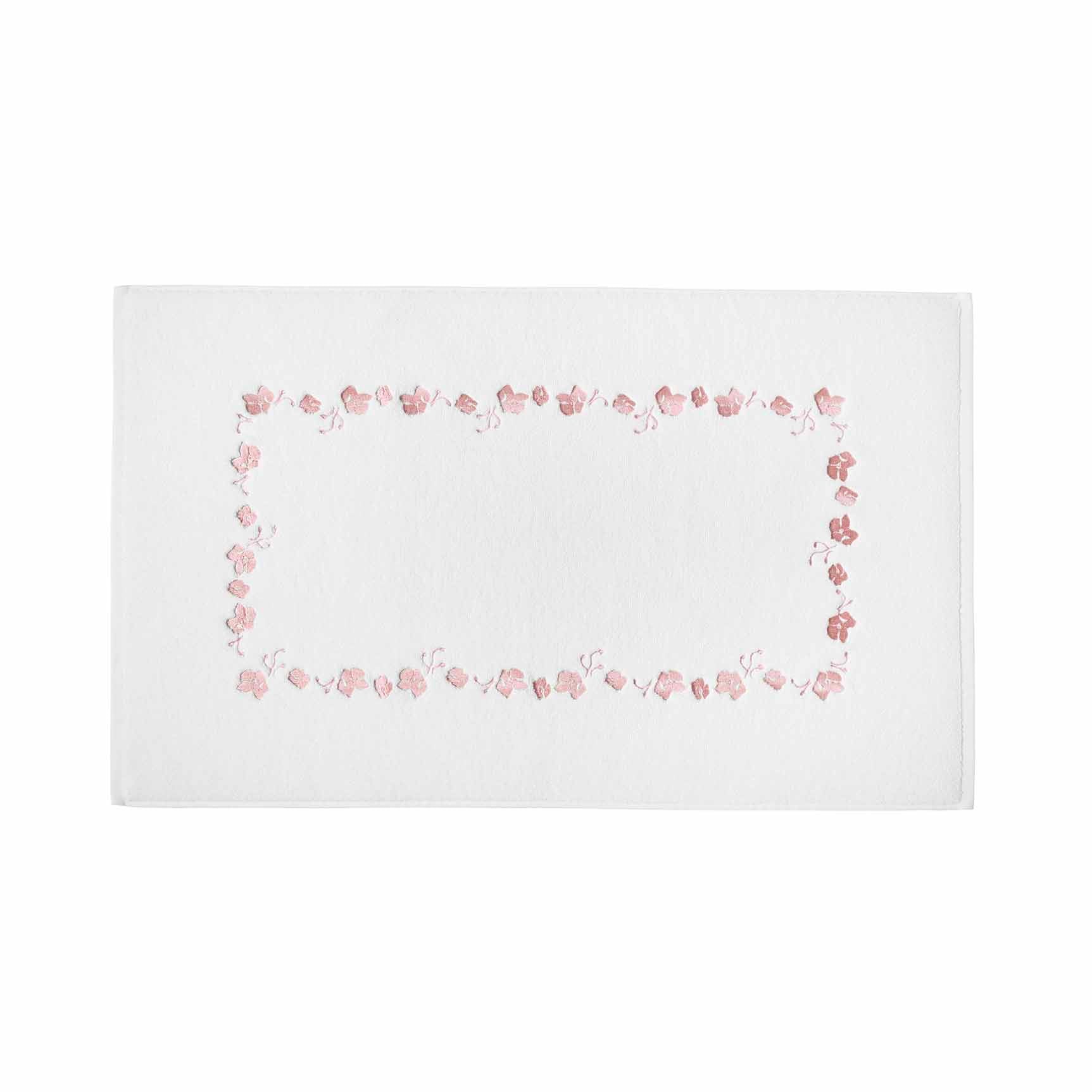white bathmat with pink embroidered botanical pattern 