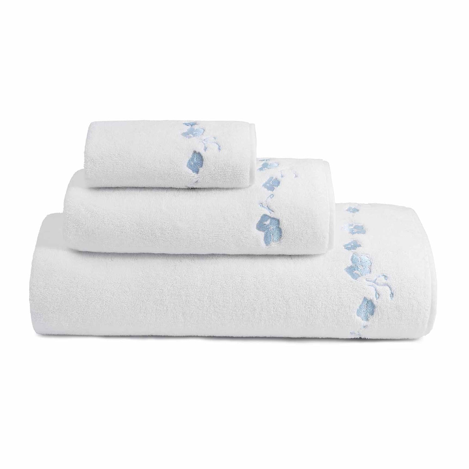 stack of different sized  white towels with blue embroidered botanical stripe pattern