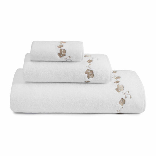 stack of different sized white towels with beige embroidered botanical stripe pattern