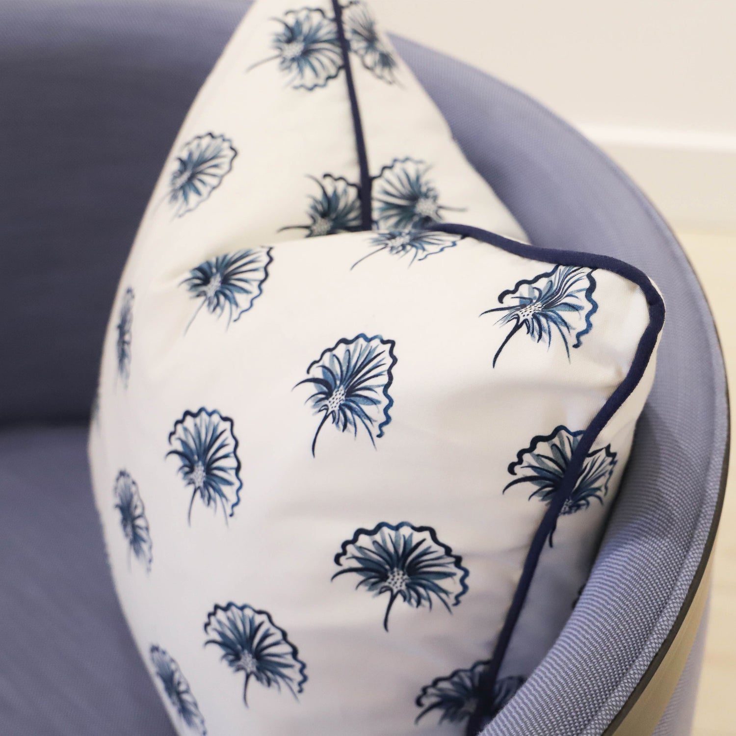 Close-Up of Floral Navy Printed Pillow on blue chair