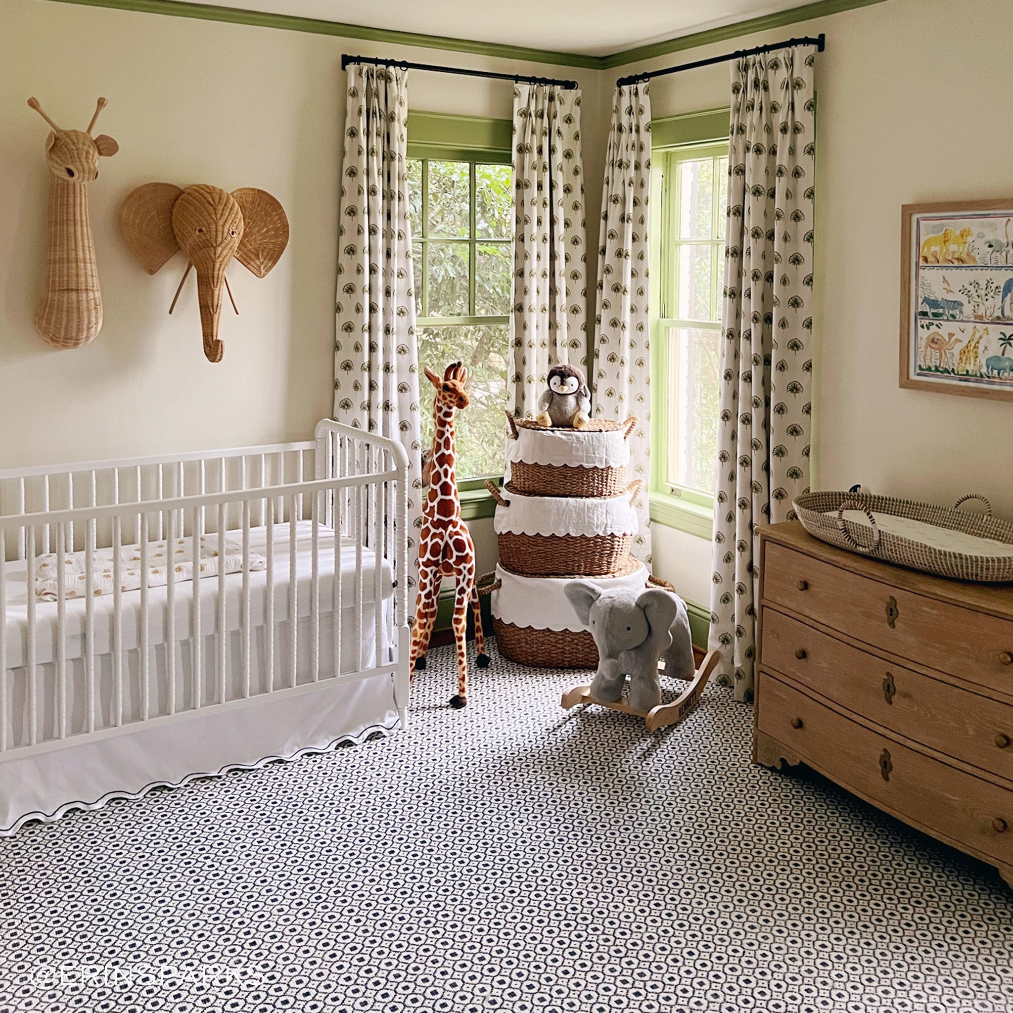 Nursery room styles with Green Floral Printed Curtains next to white crib and wooden dresser. Photo taken by Erin Spark