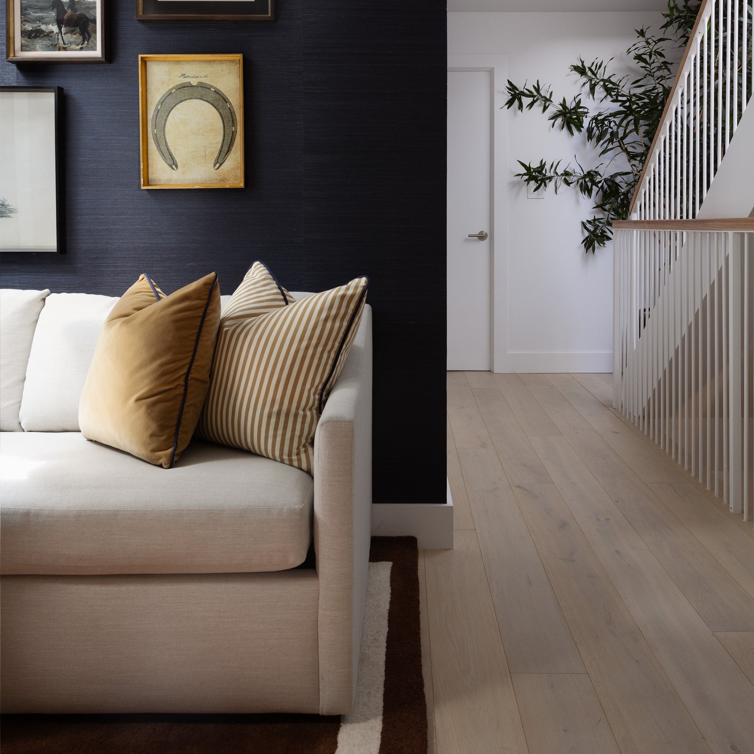 Louisa Camel cushions in warm earthy hues add a custom touch of timeless sophistication to this modern living room.