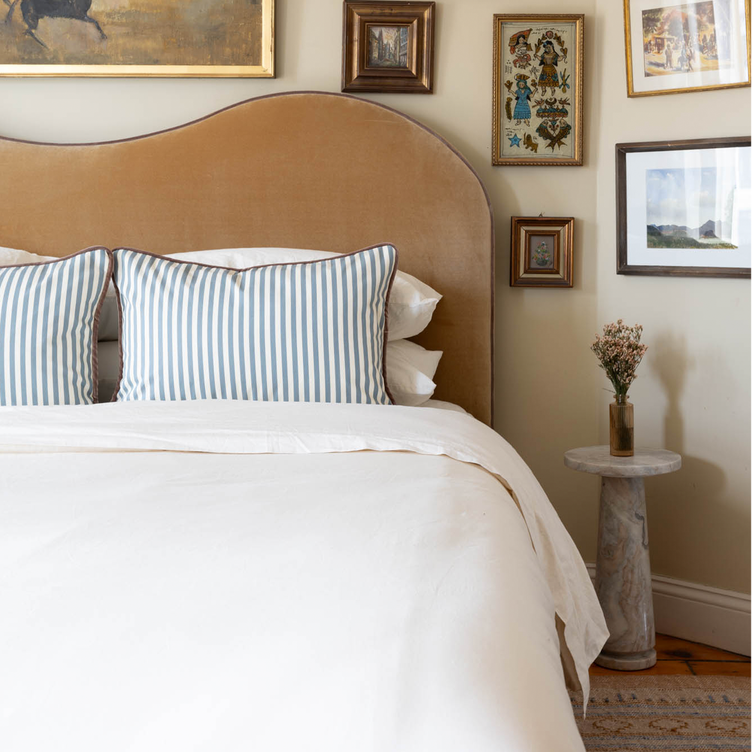 Louisa Harbor custom striped pillows in deep blue add timeless charm and modern style to your cozy bedroom.