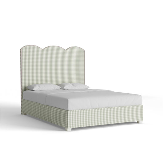 The Millie Sage Theodora Bed with scalloped headboard in custom woven fabric, blending timeless charm and sophistication.