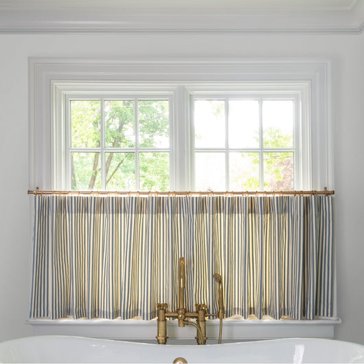 Louisa Harbor Tailored Pleat custom cafe curtains by Pepper Home with blue and white stripes in a bright kitchen window.