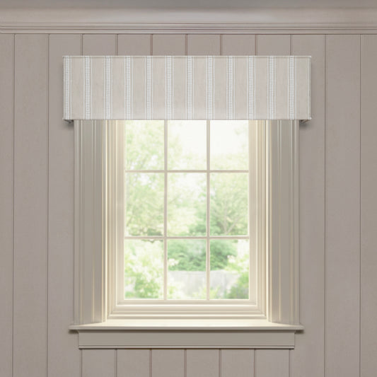 Margot Flour custom cornice with soft embroidered vertical stripes, designed for made-to-order window accents and style