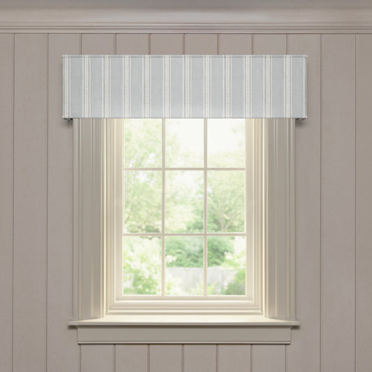 Margot Mist custom cornice with soft embroidered vertical stripes, designed for made-to-order window accents and style
