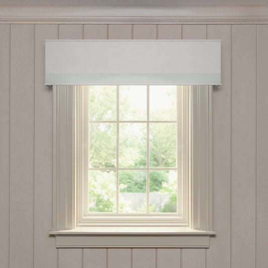 Flour solid linen cornice with a tailored look and subtle trim, offering customizable and made-to-order window elegance