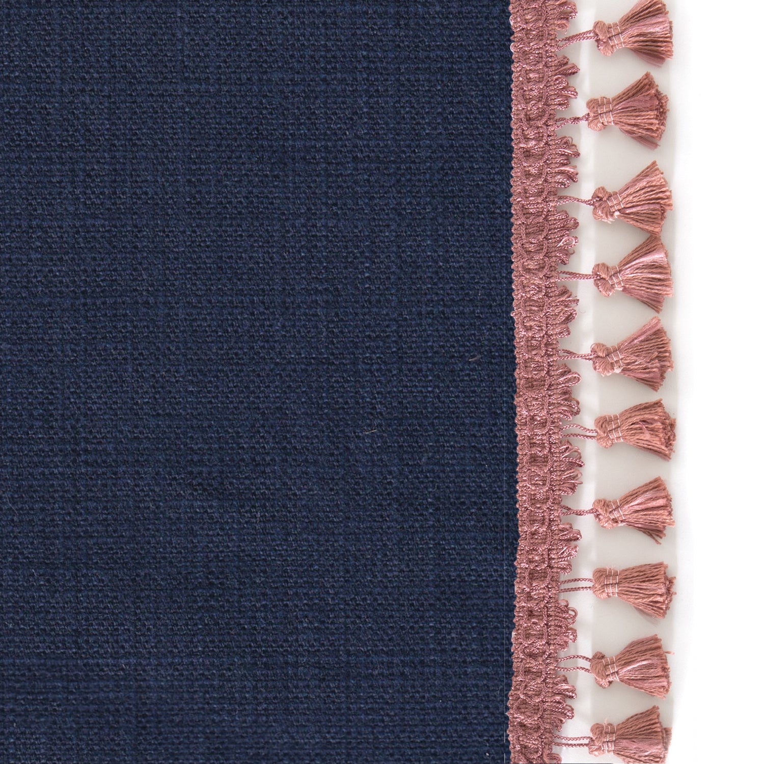 Upclose picture of Midnight custom Navy Bluecurtain with dusty rose tassel trim