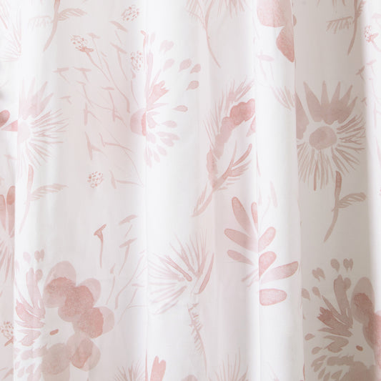 close up of pink floral curtain 