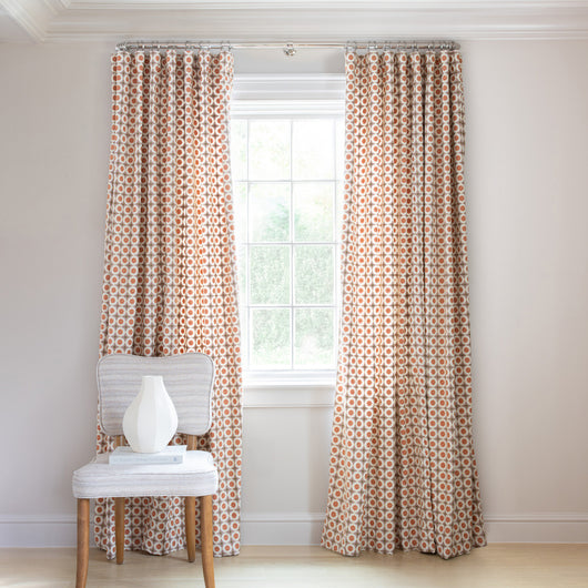 Hayes Coral Tailored Pleat curtains by Pepper Home with custom geometric pattern for a stylish window treatment.