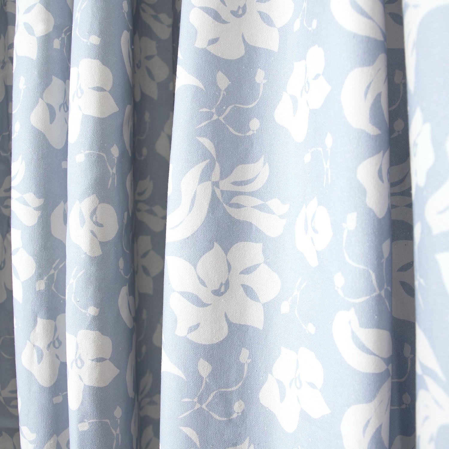 close up of blue floral curtain 