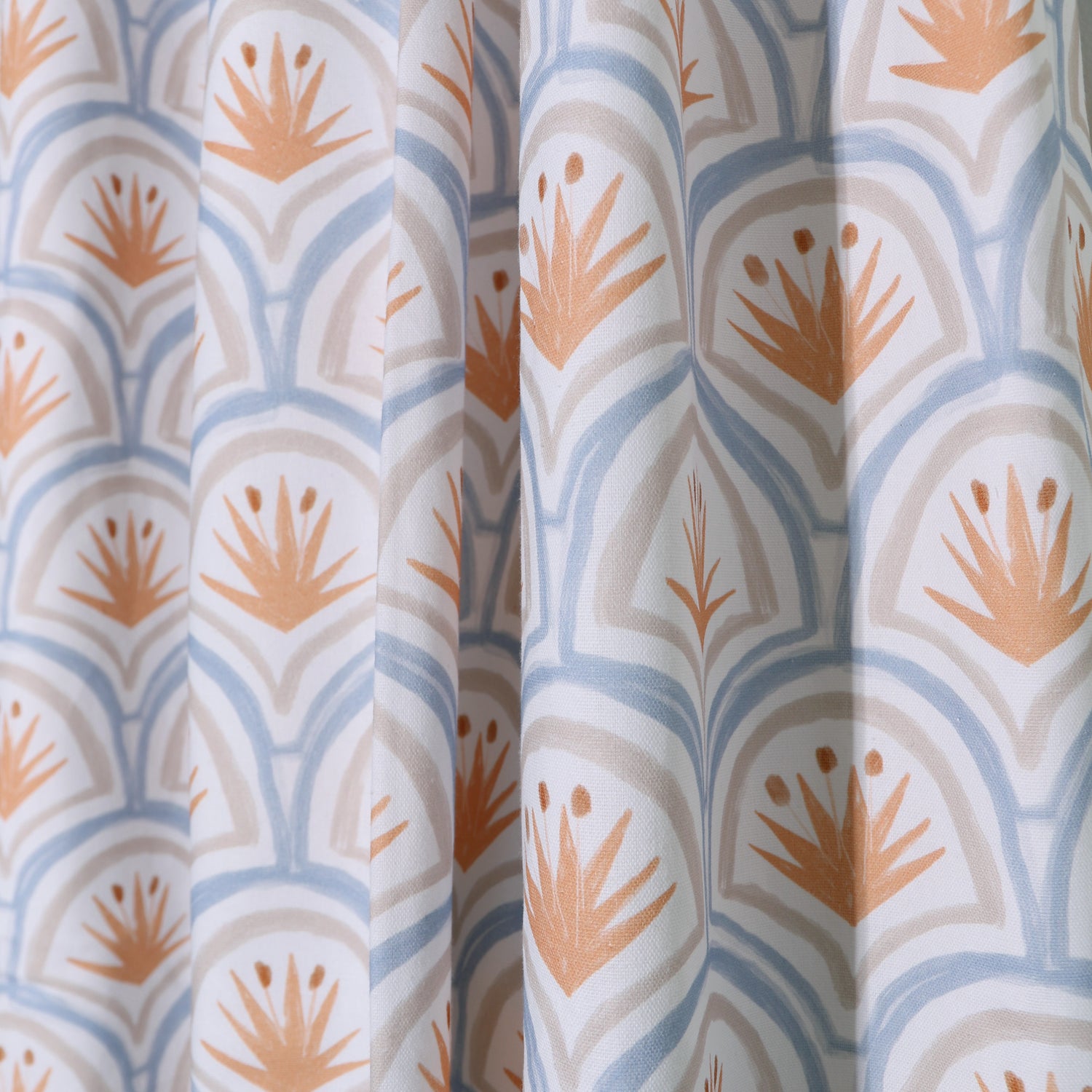 close up of blue and orange art deco palm pattern curtain 