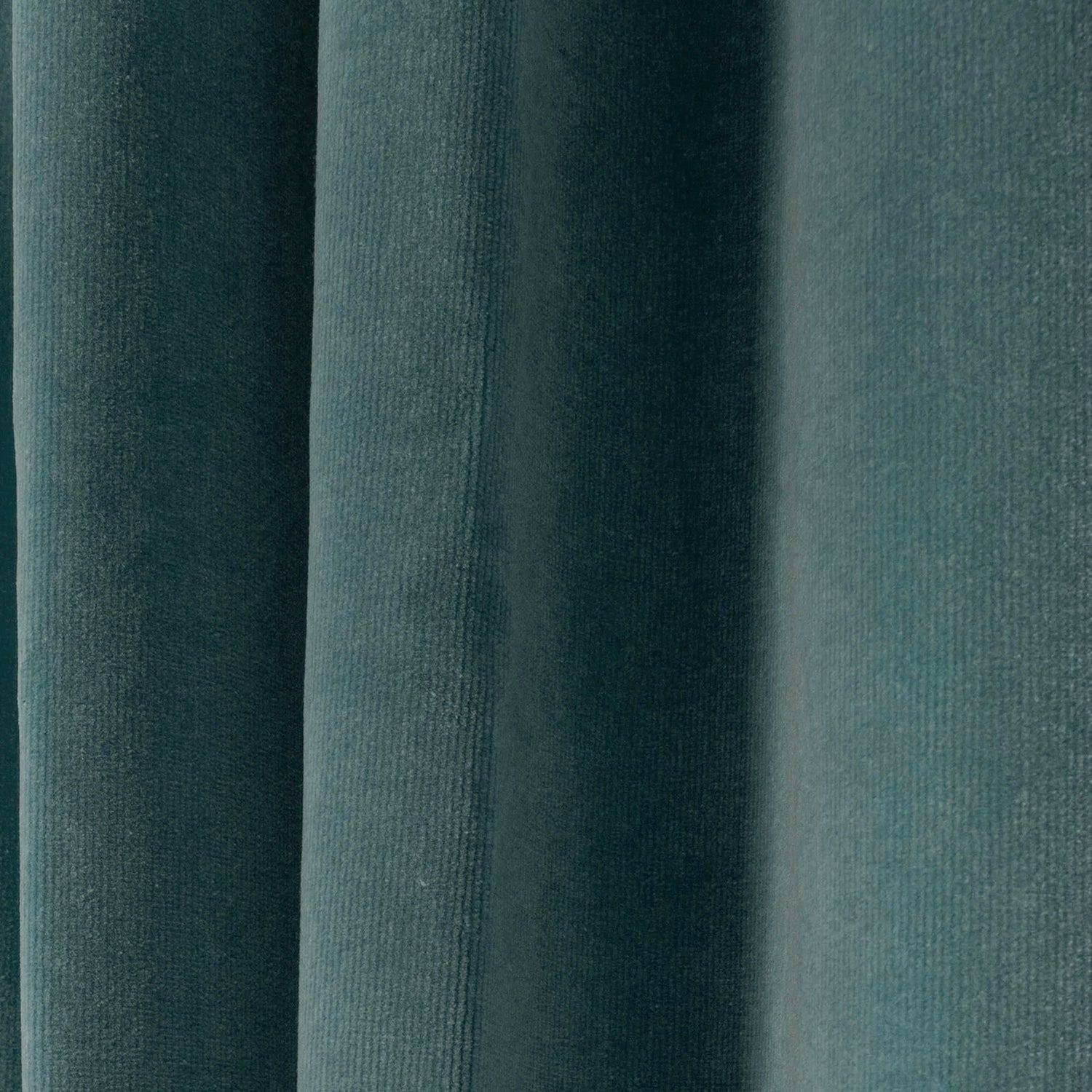 close up of peacock blue velvet curtain