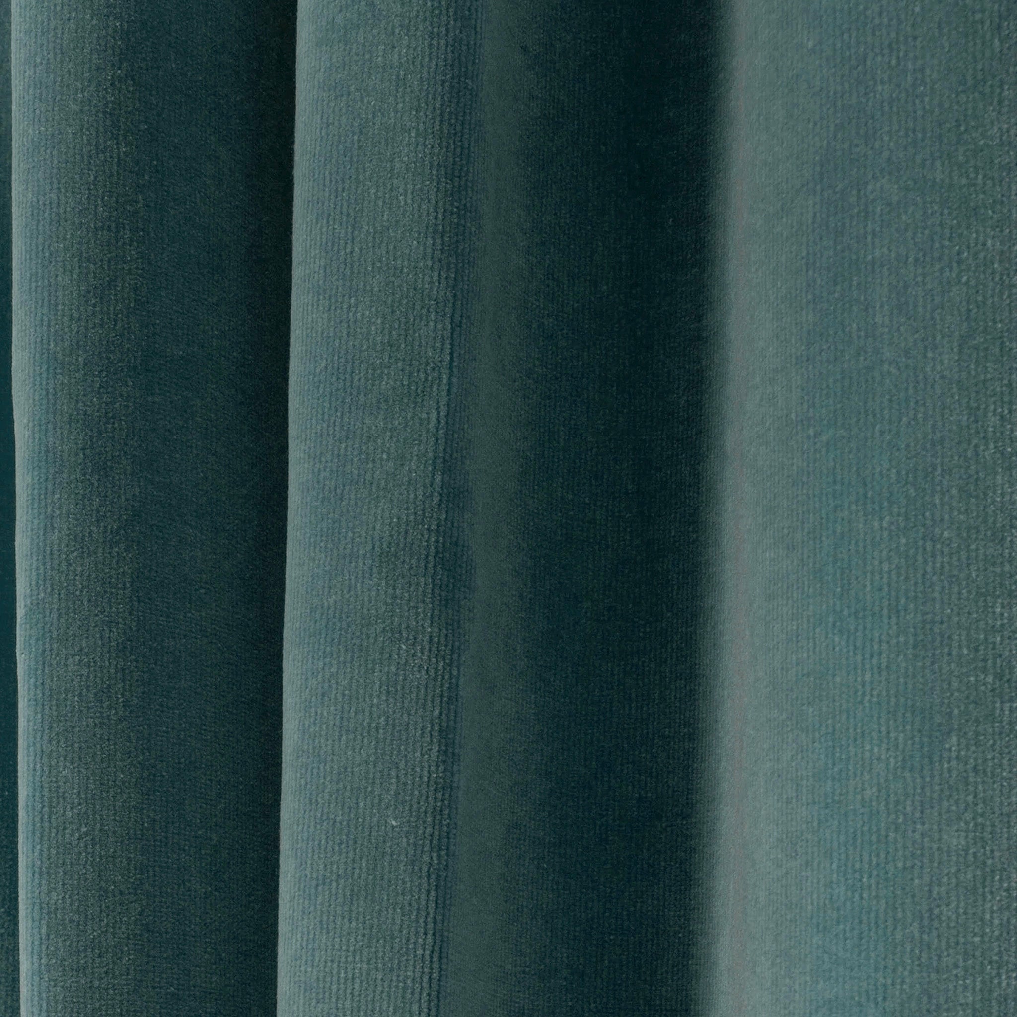 close up of peacock blue velvet curtain