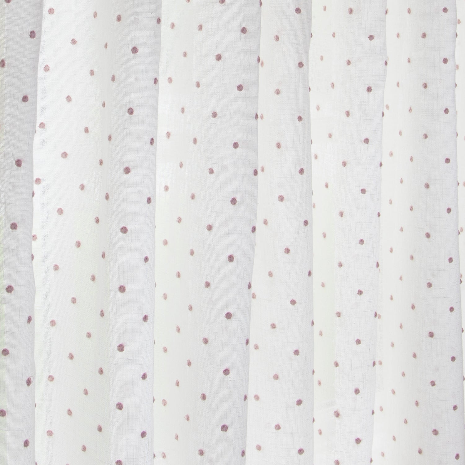 close up of white sheer curtain with embroidered pink polka dots