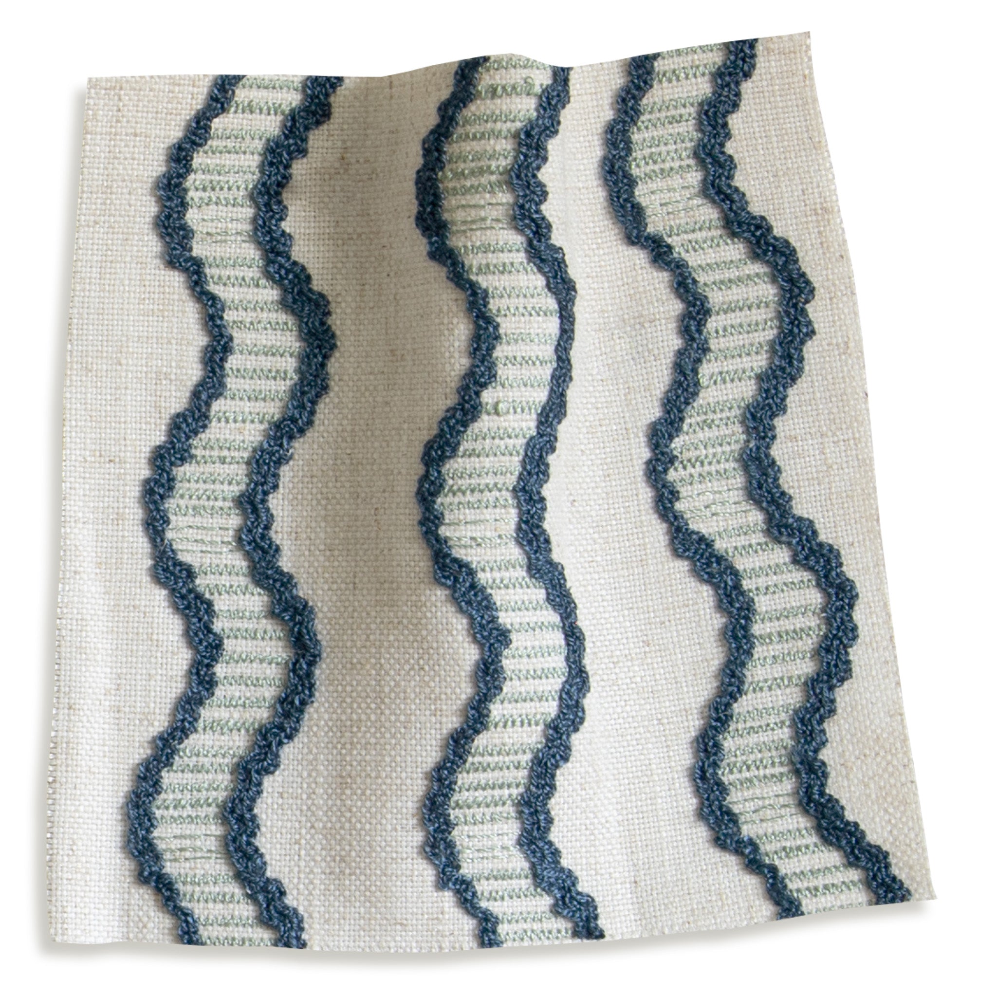 embroidered cream fabric with wavy blue lines swatch