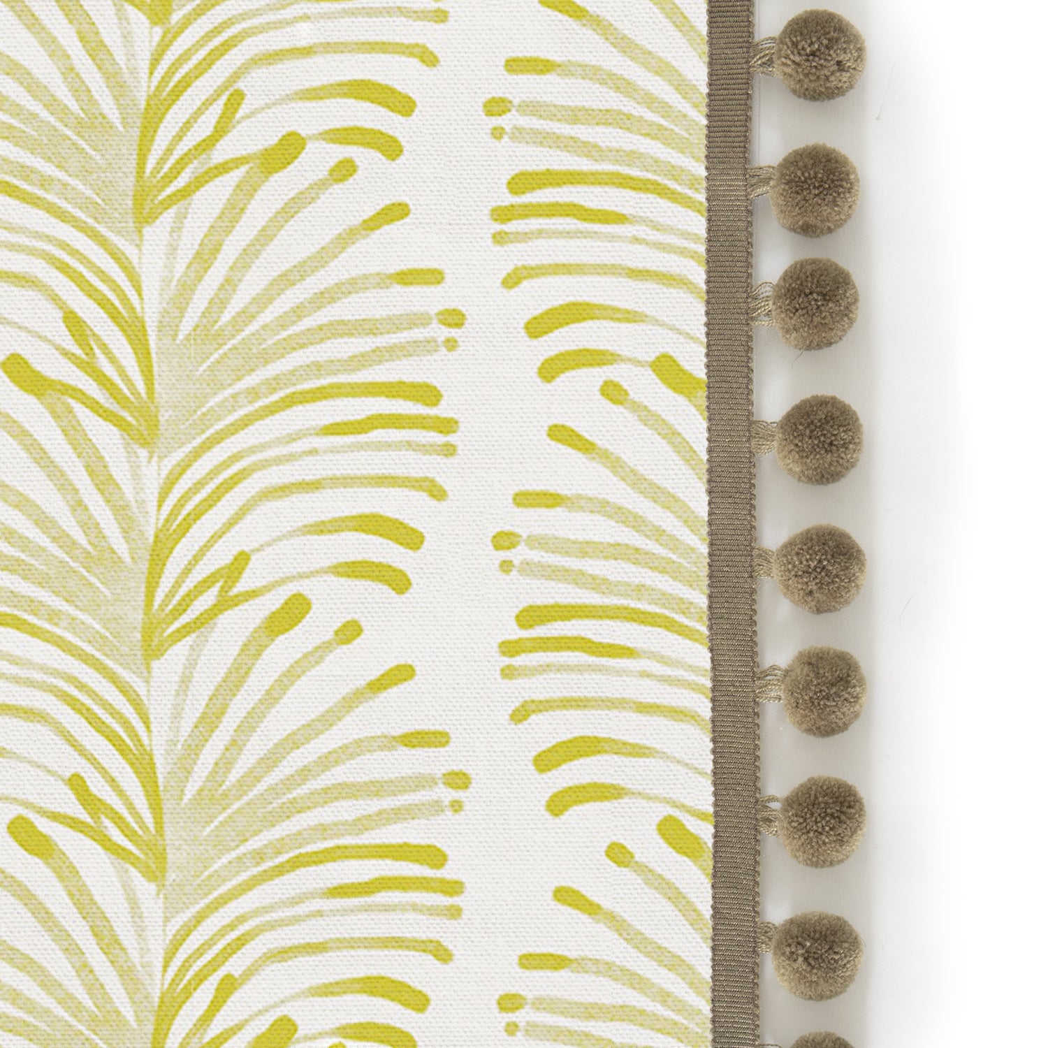 Upclose picture of Emma Chartreuse custom curtain with olive pom pom trim