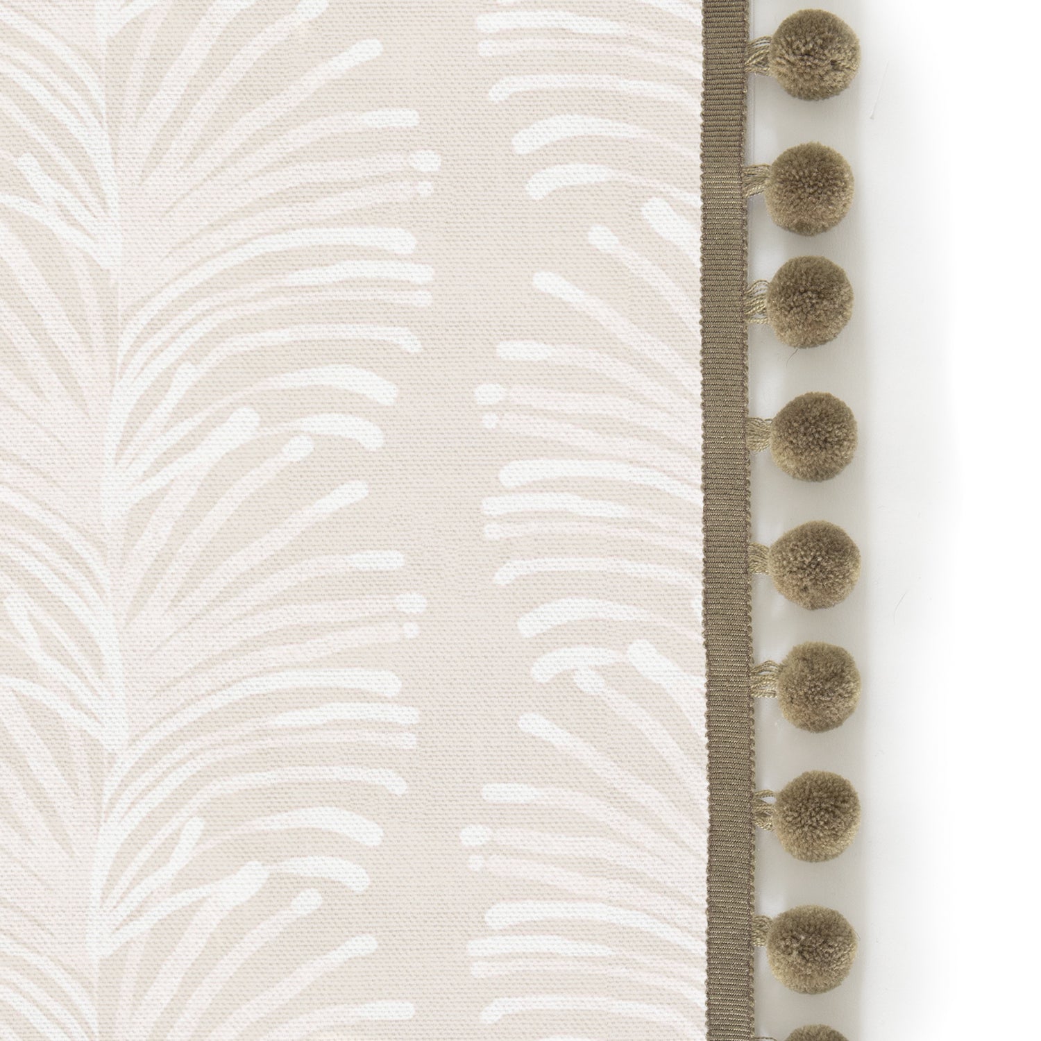 Upclose picture of Emma Sand custom shower curtain with olive pom pom trim