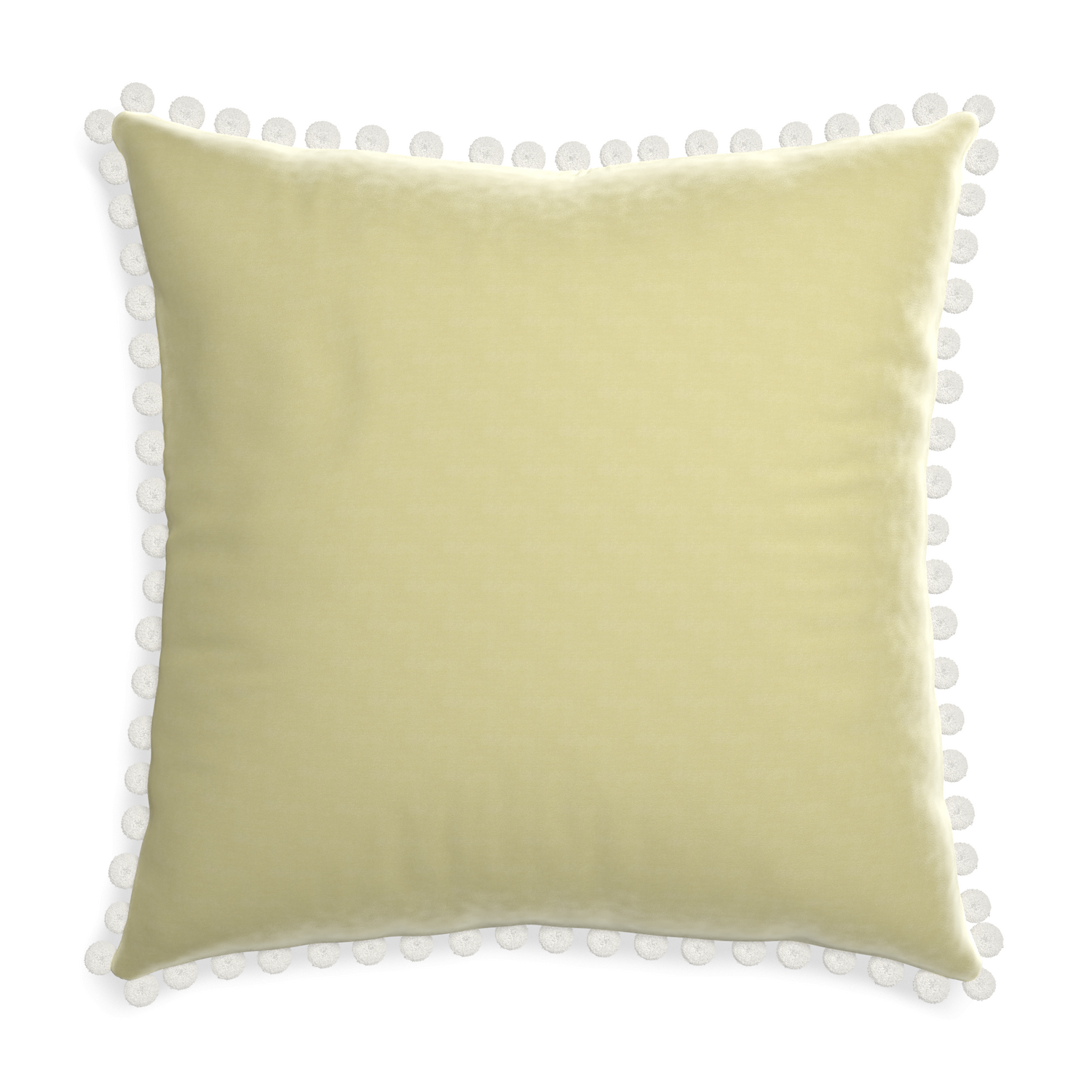 square light green pillow with white pom poms