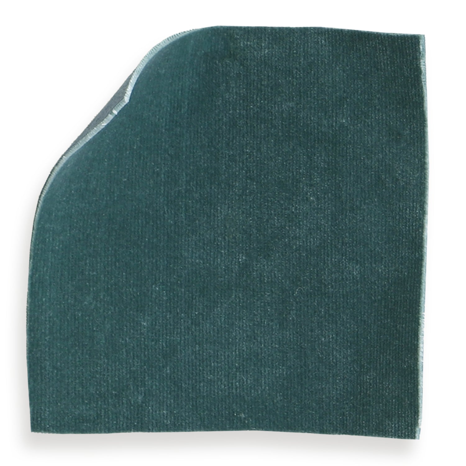 Close-up of teal fabric texture on the headboard showing weave and finish.