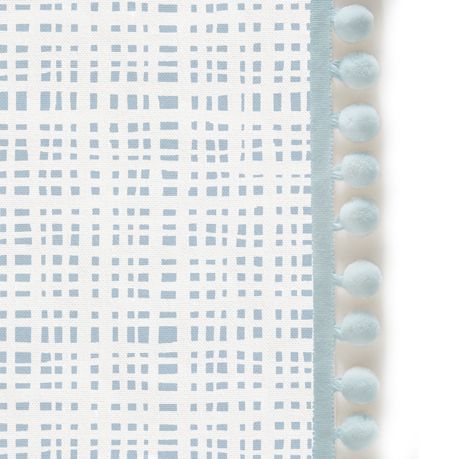 Upclose picture of Ginger Sky custom Sky Blue Ginghamshower curtain with powder pom pom trim