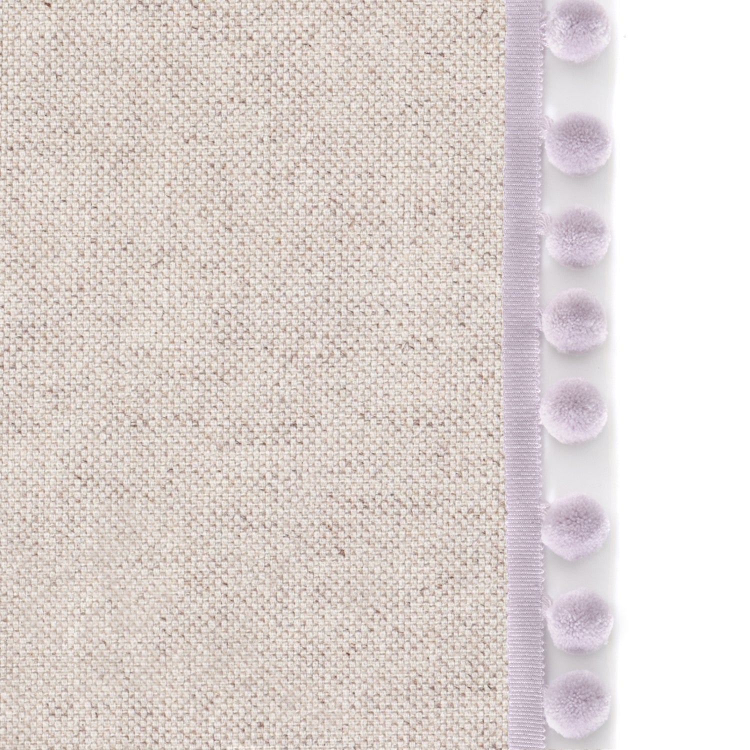 Upclose picture of Oat custom Linen Oatcurtain with lilac pom pom trim