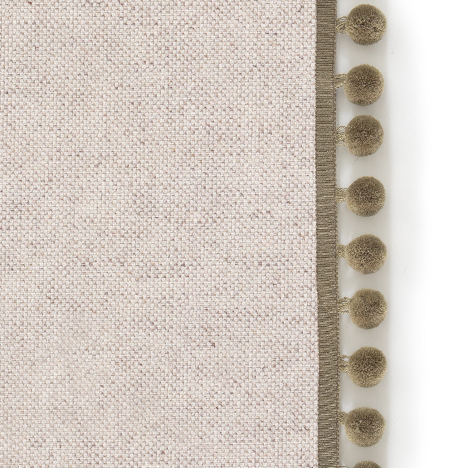 Upclose picture of Oat custom Linen Oatcurtain with olive pom pom trim