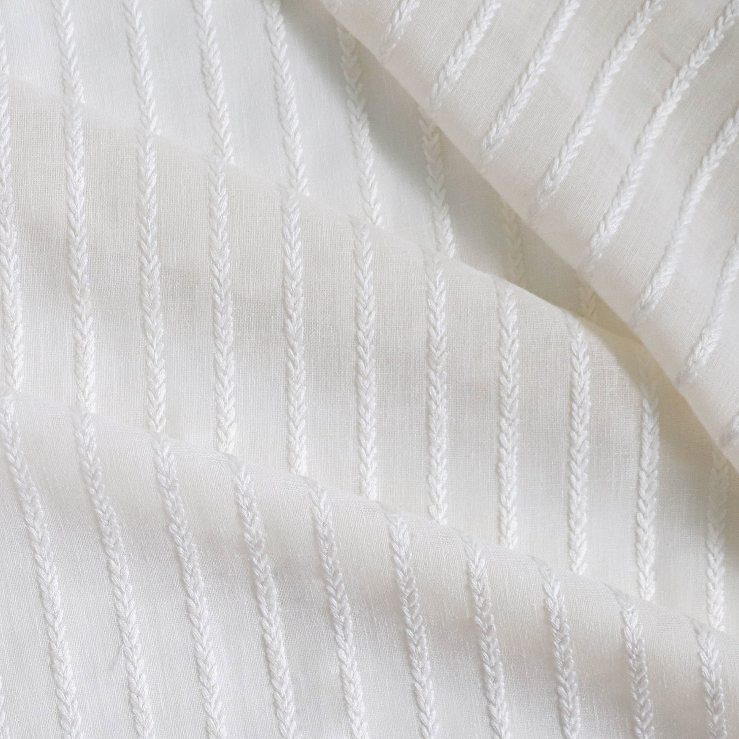 sheer natural white with white embroidered stripes fabric 