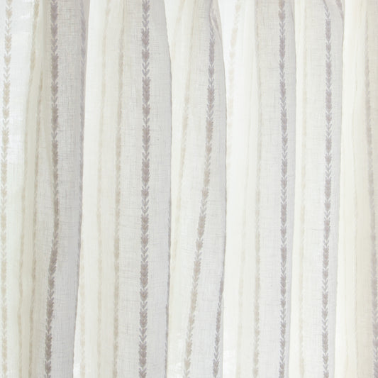 close up of natural white curtain with neutral stripe pattern