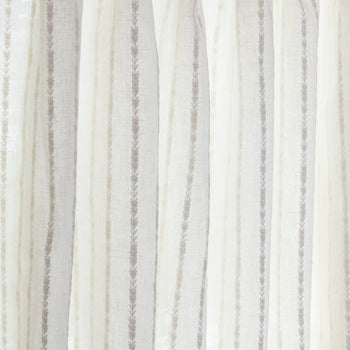 close up of natural white curtain with neutral stripe pattern