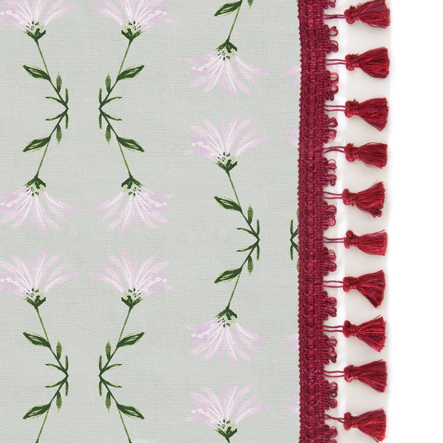 Upclose picture of Marina Sage custom curtain with raspberry tassel trim