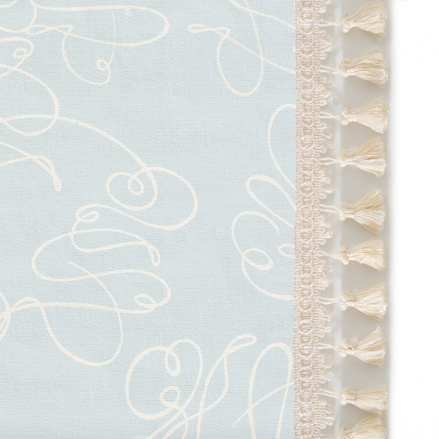 Upclose picture of Mirabella custom Powder Blue Abstractshower curtain with cream tassel trim