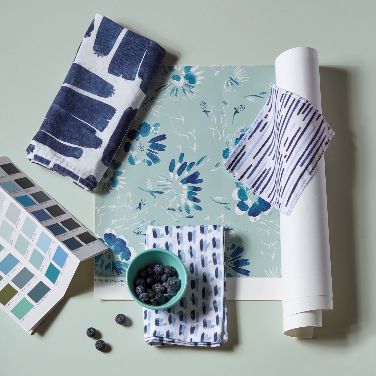 Interior design moodboard and fabric inspirations with Sky and Navy Blue Poppy Printed Swatch, Navy Brushstokes Pattern Printed Swatch, and Floral Navy printed swatch