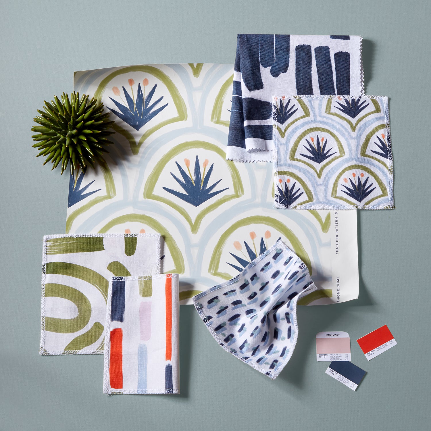 Interior design moodboard and fabric inspirations with Moss Green Printed Swatch, Art Deco Palm Pattern Printed Swatch, Sky and Navy Blue Poppy Printed Swatch, and Navy Brushstokes Pattern Printed Swatch