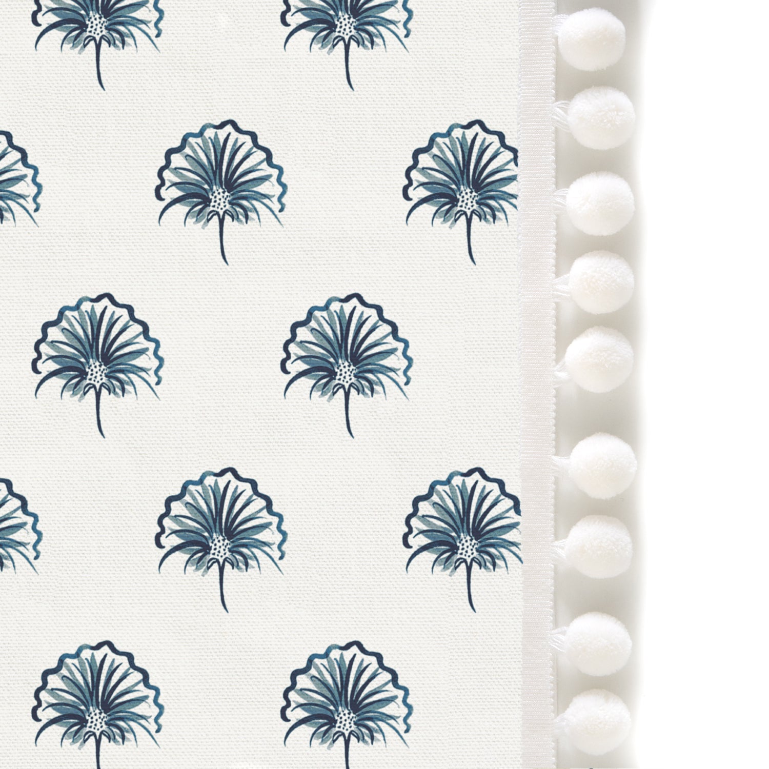 Upclose picture of Penelope Midnight custom shower curtain with snow pom pom trim