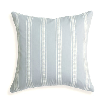 Margot Mist pillow with custom white embroidered stripes on soft blue, bringing serene coastal charm to your space.