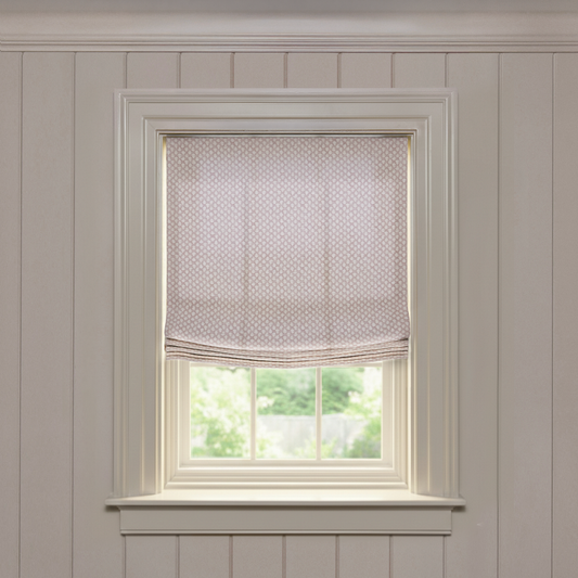 Quinn Mushroom Relaxed roman shade in soft beige with a subtle repeating geometric print, custom made-to-order design