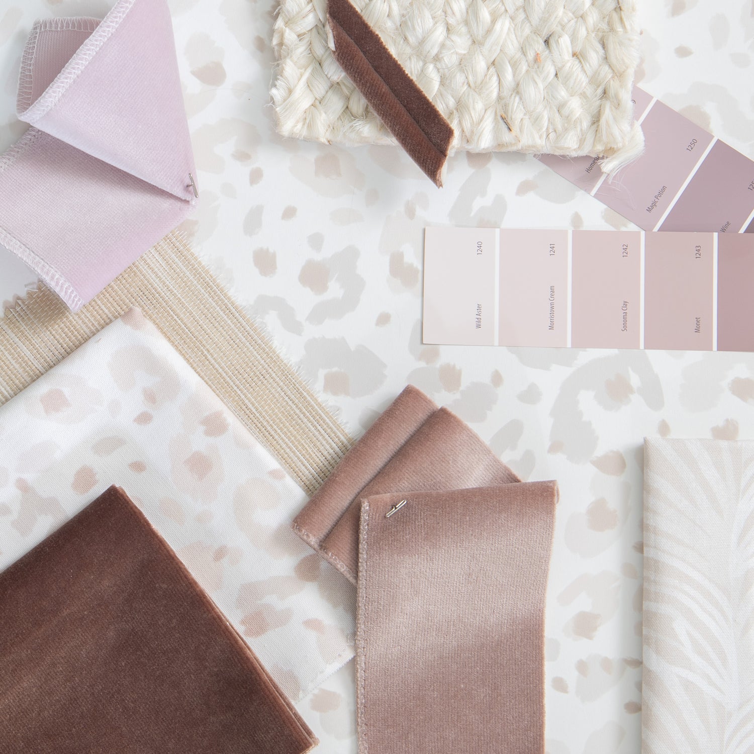 Interior design moodboard and fabric inspirations with mauve velvet swatch, pink velvet swatch, beige animal print swatch, and beige botanical stripe printed swatch