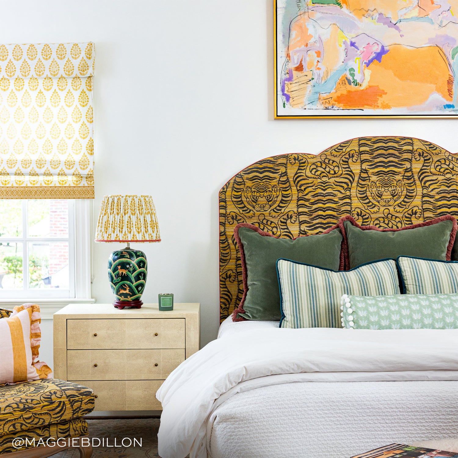 fern green velvet pillows with pink fringe and Coastal Inspired Green and Blue floral pattern pillow on a bed with a tiger print headboard and white bedding