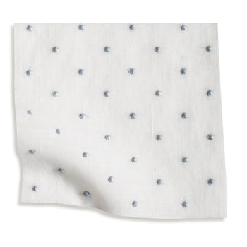 sheer white embroidered blue polka dot fabric swatch