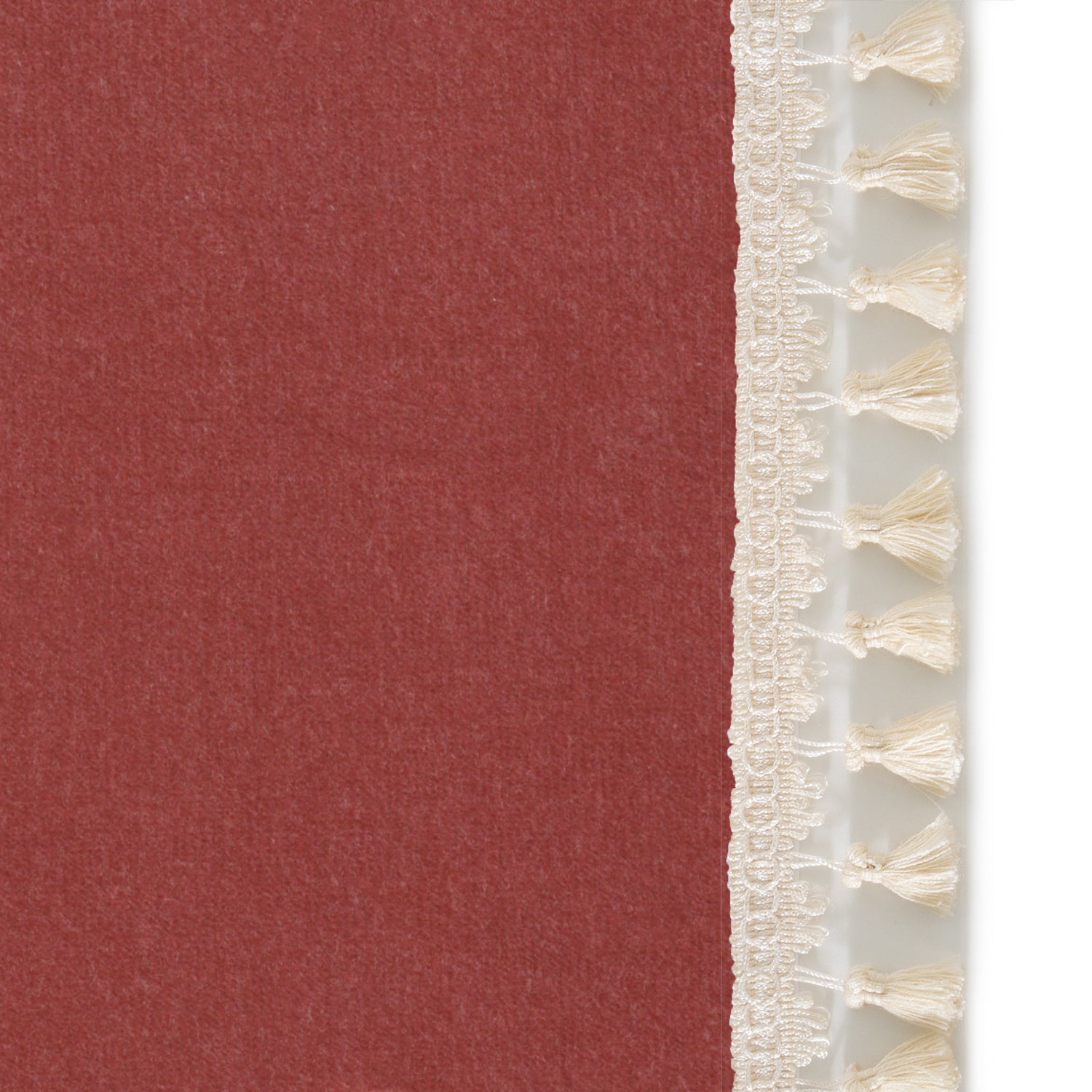 Upclose picture of Cosmo Velvet custom curtain with cream tassel trim