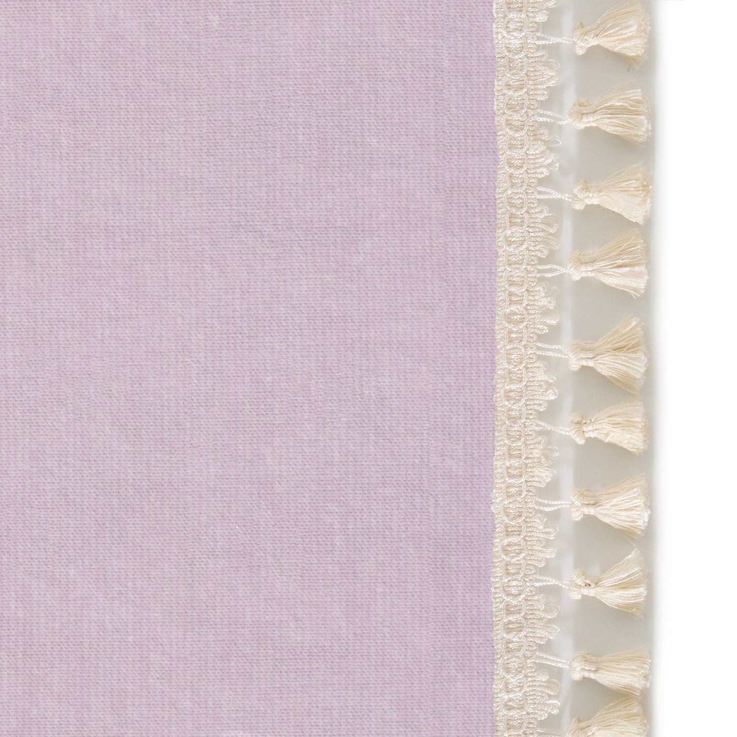 Upclose picture of Lilac Velvet custom curtain with cream tassel trim