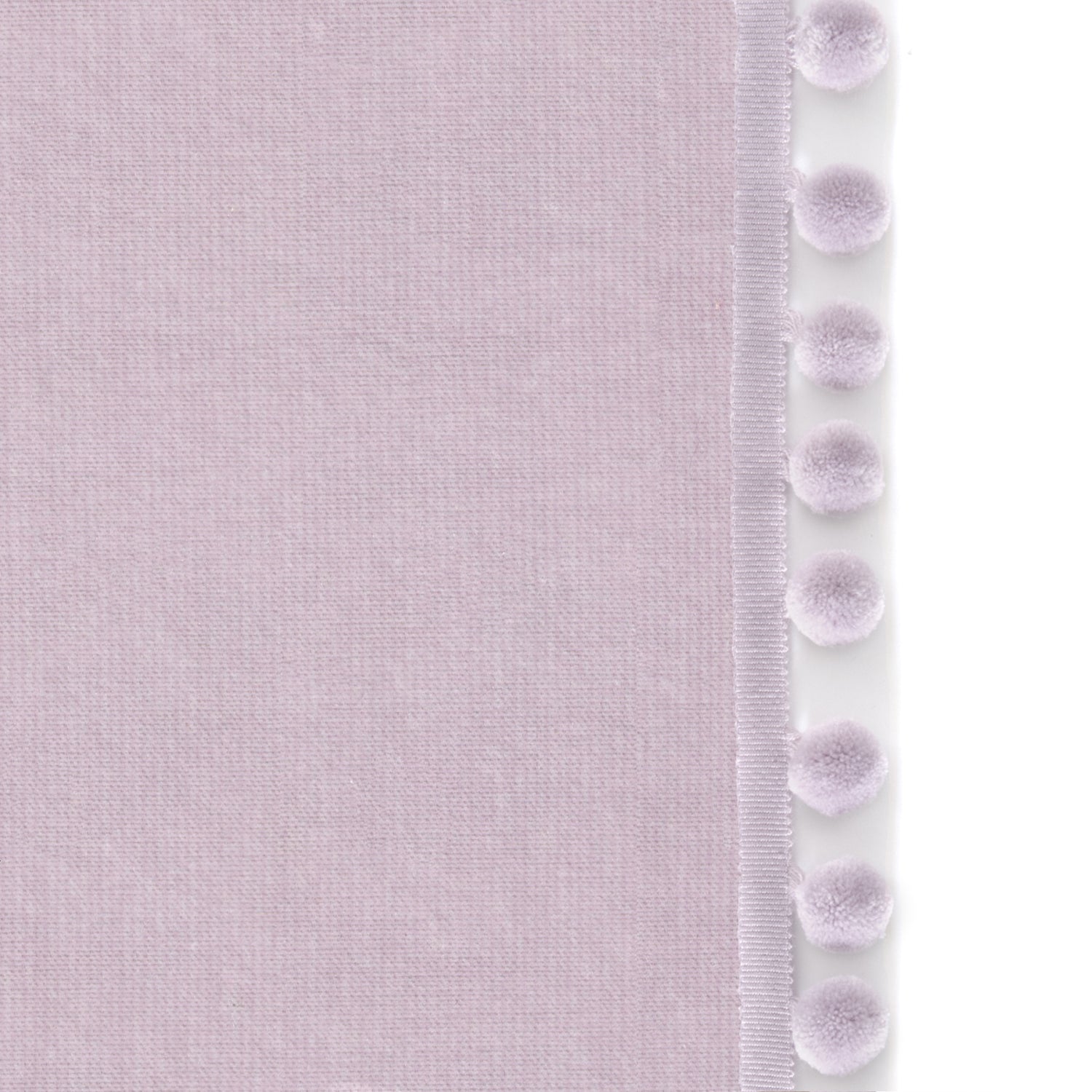 Upclose picture of Lilac Velvet custom curtain with lilac pom pom trim