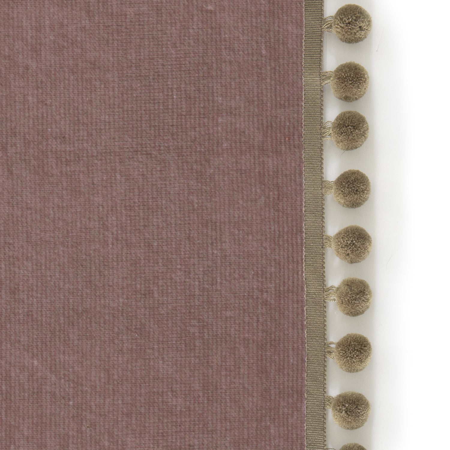 Upclose picture of Mauve Velvet custom curtain with olive pom pom trim