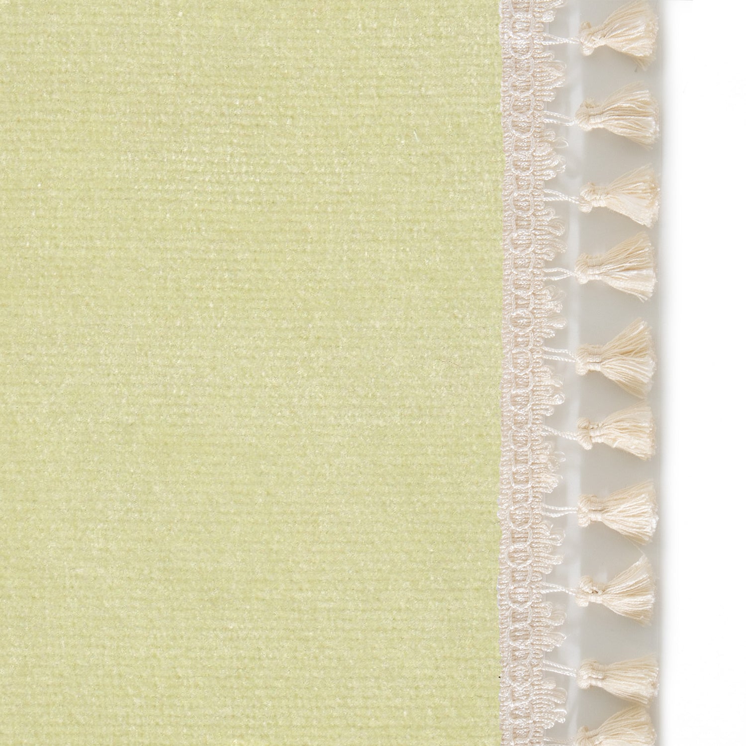 Upclose picture of Pear Velvet custom curtain with cream tassel trim